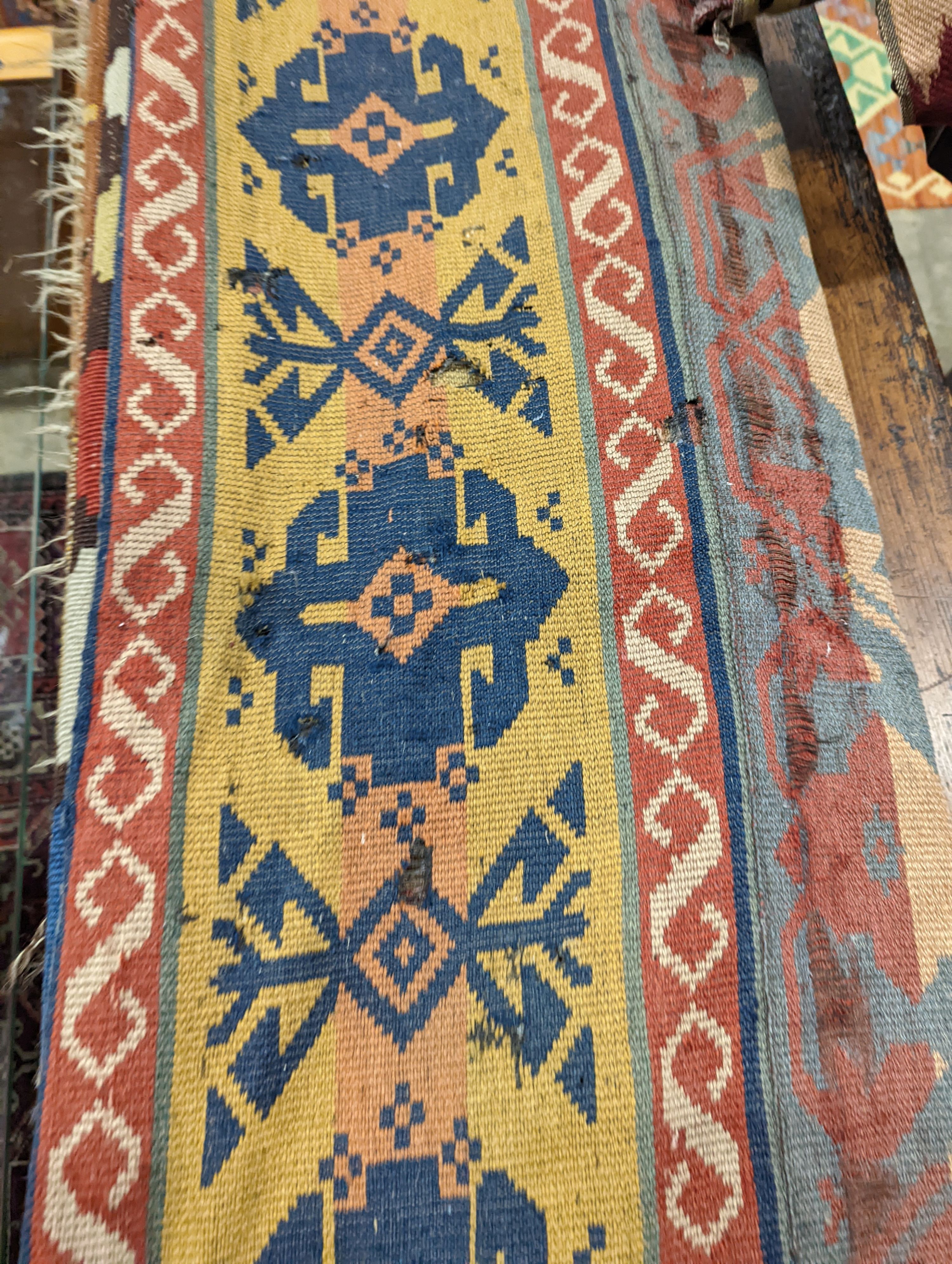 Two antique Kilim hall carpets, both with striped geometric decoration 270 x 128cm and 272 x 158cm both with some holes, 272 x 158cm